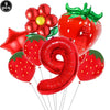 A set of red strawberry shaped balloons and a large red number nine balloon for a party kit