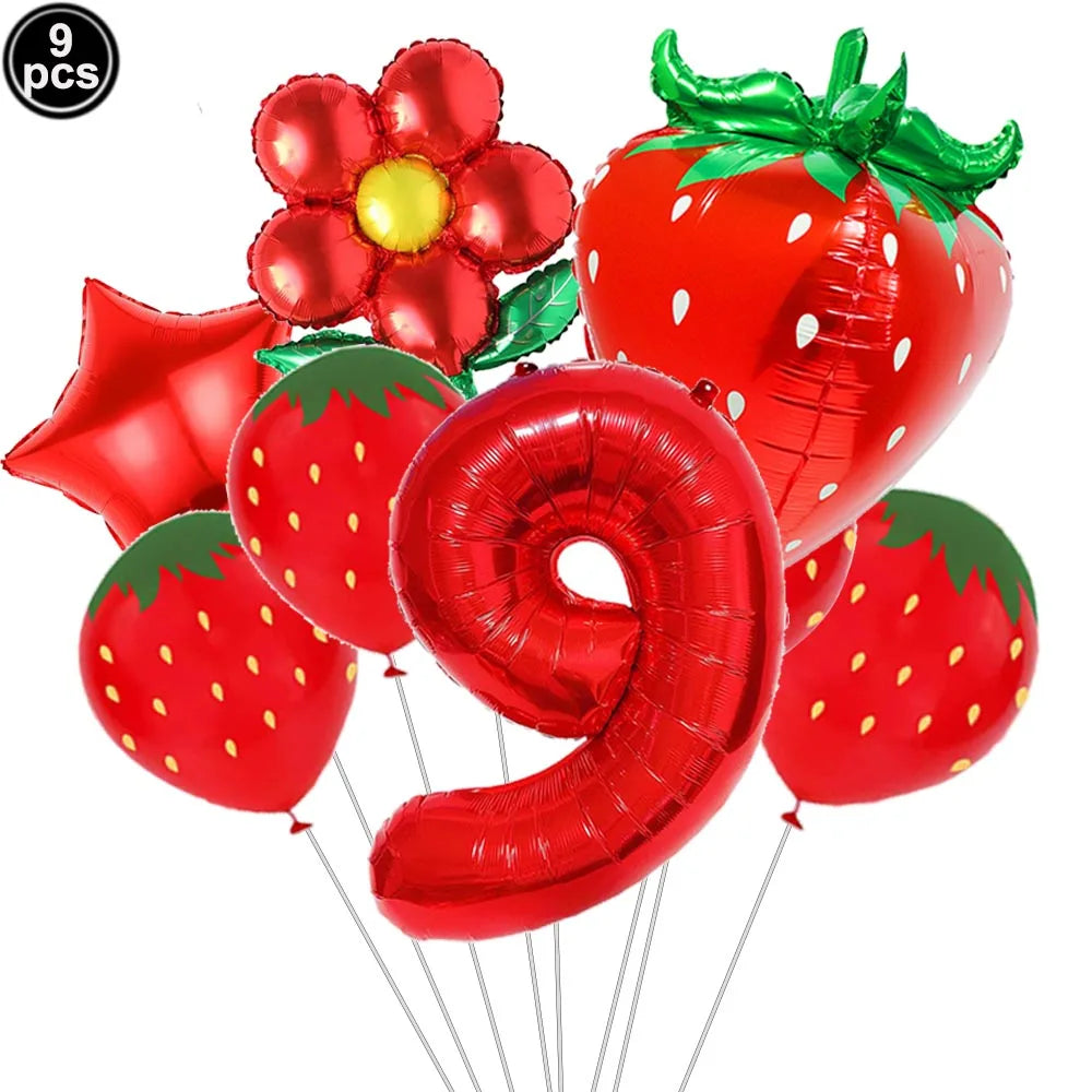 A set of red strawberry shaped balloons and a large red number nine balloon for a party kit