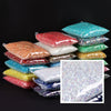 A collection of colorful precision resin rhinestones in various shades and sizes displayed on a dark background.