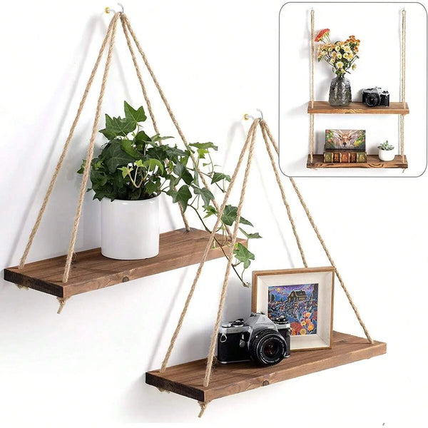 A wooden hanging shelf with hemp rope is mounted on a wall, displaying a potted plant and a camera in a floating display.