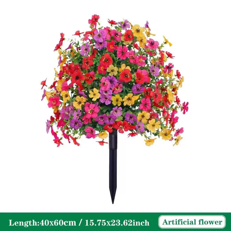 A vibrant bouquet of artificial petunias in various shades of pink, red, and yellow arranged on a ground stake.