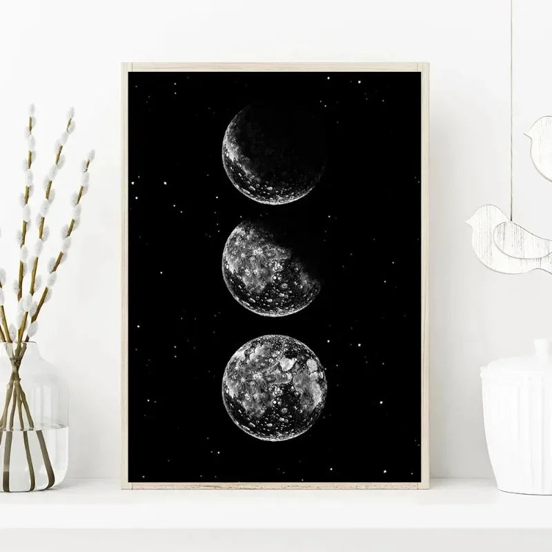 Minimalist black and white canvas wall art featuring three celestial bodies against a dark background