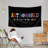 A black tapestry wall hanging featuring the text ASTROWORLD and WISH YOU WERE HERE in colorful letters.