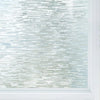 Close-up of frosted glass window privacy film with a light blue and white striped pattern.