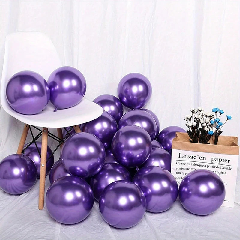 A collection of purple balloons displayed on a white surface against a white background.