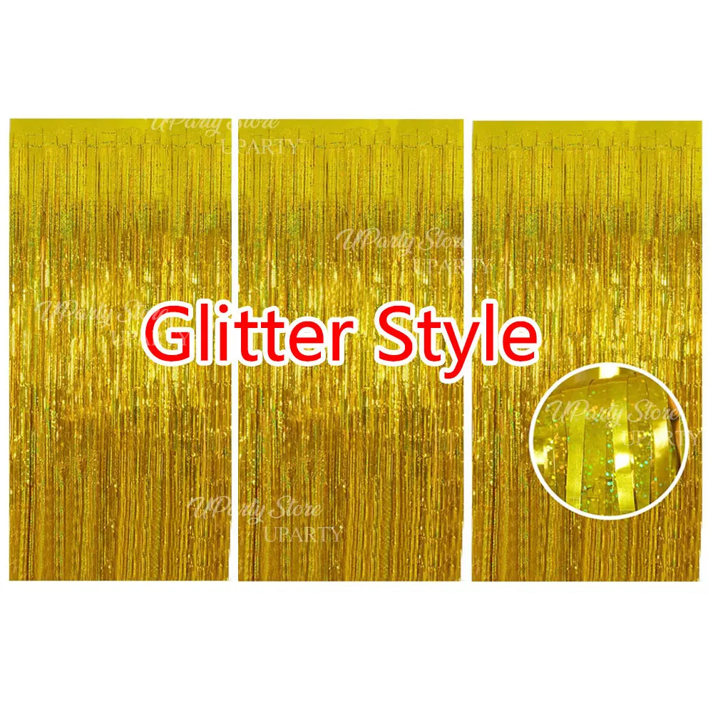 Three panels of gold glitter foil fringe curtains used for party backdrop decor