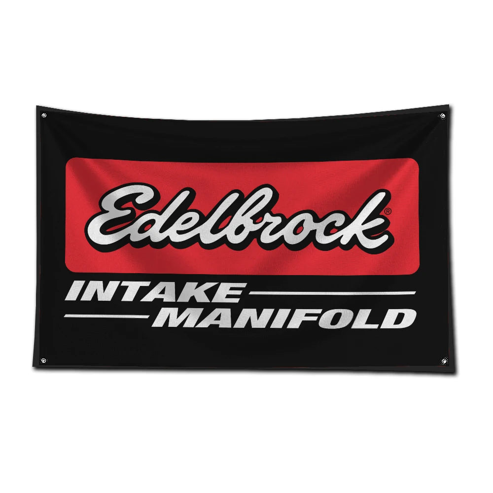 A black racing flag featuring the Edelbrock intake manifold logo in red and white text.
