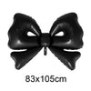 Black foil bow shaped like a cupcake topper for birthday or bridal shower