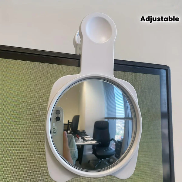 A white adjustable 360 degree convex mirror mounted on a wall, reflecting an office interior.
