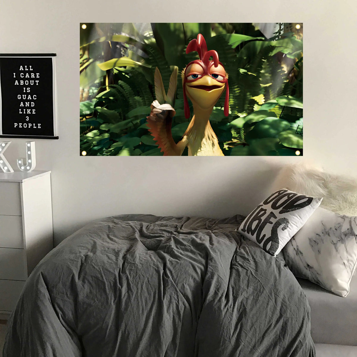 A framed picture of a funny chicken with a flag for indoor decor