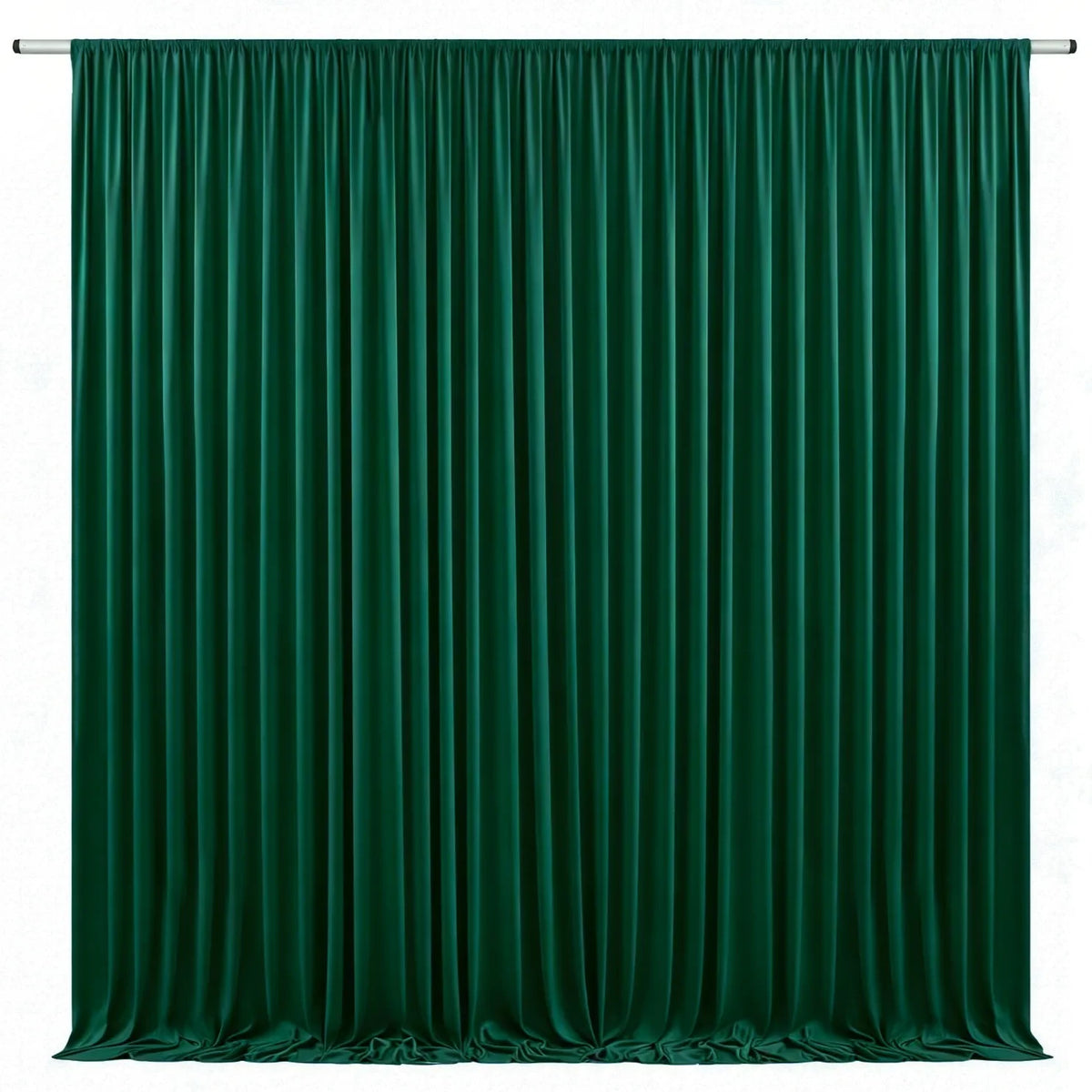 A floor-to-ceiling emerald green velvet curtain with vertical pleats used as an elegant drapery backdrop.