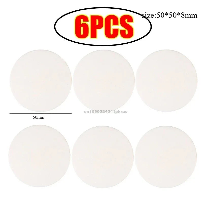 Six white silicone door stoppers or bumpers, each measuring 50mm in diameter.