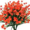 A bundle of bright orange artificial flowers used for home and event decoration.