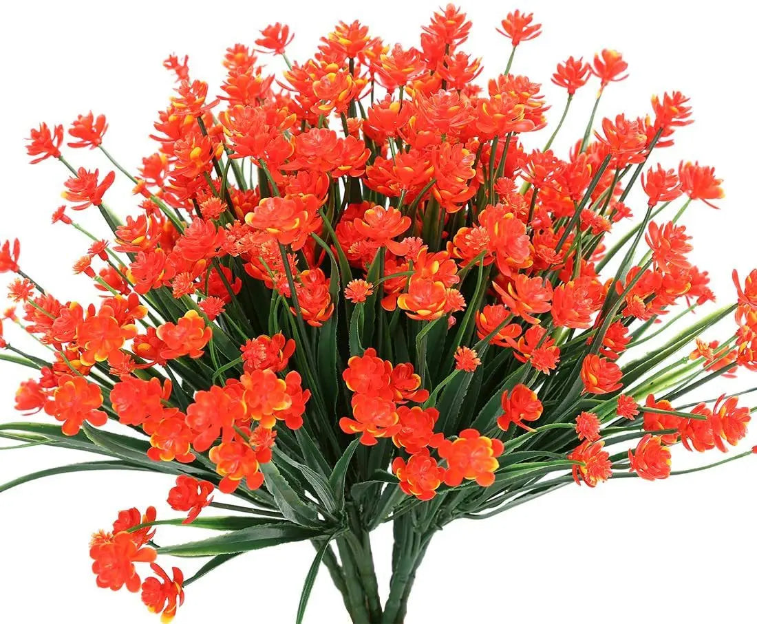 A bundle of bright orange artificial flowers used for home and event decoration.