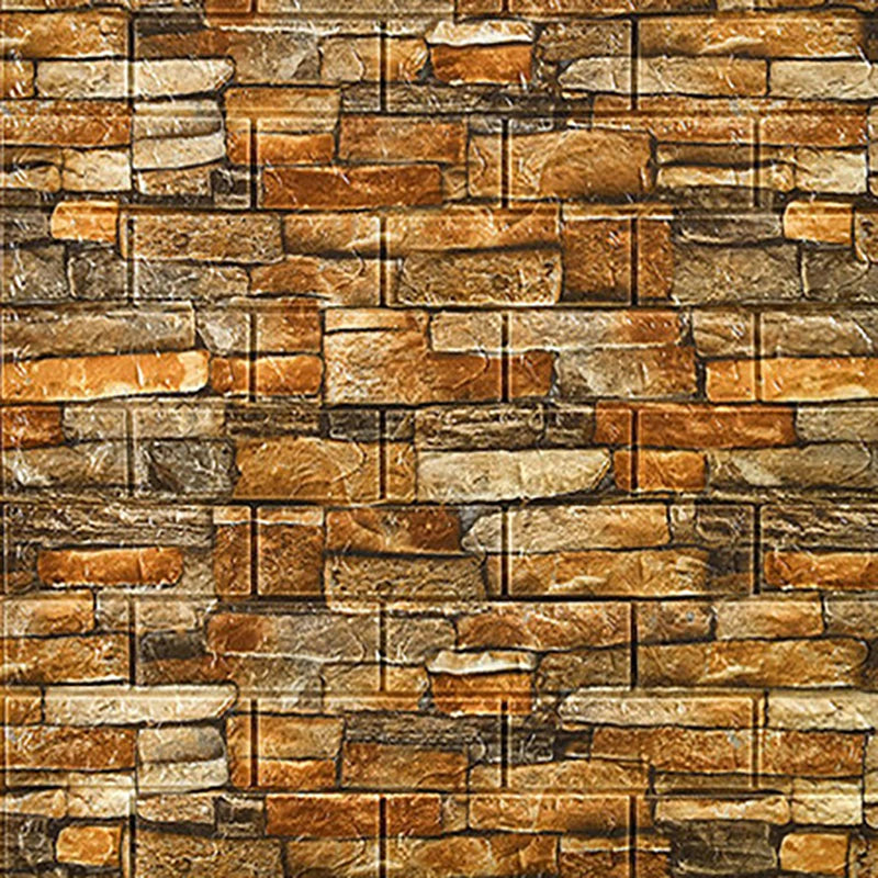 A textured stone veneer wall panel featuring mixed earth tones of brown, tan, and gray.