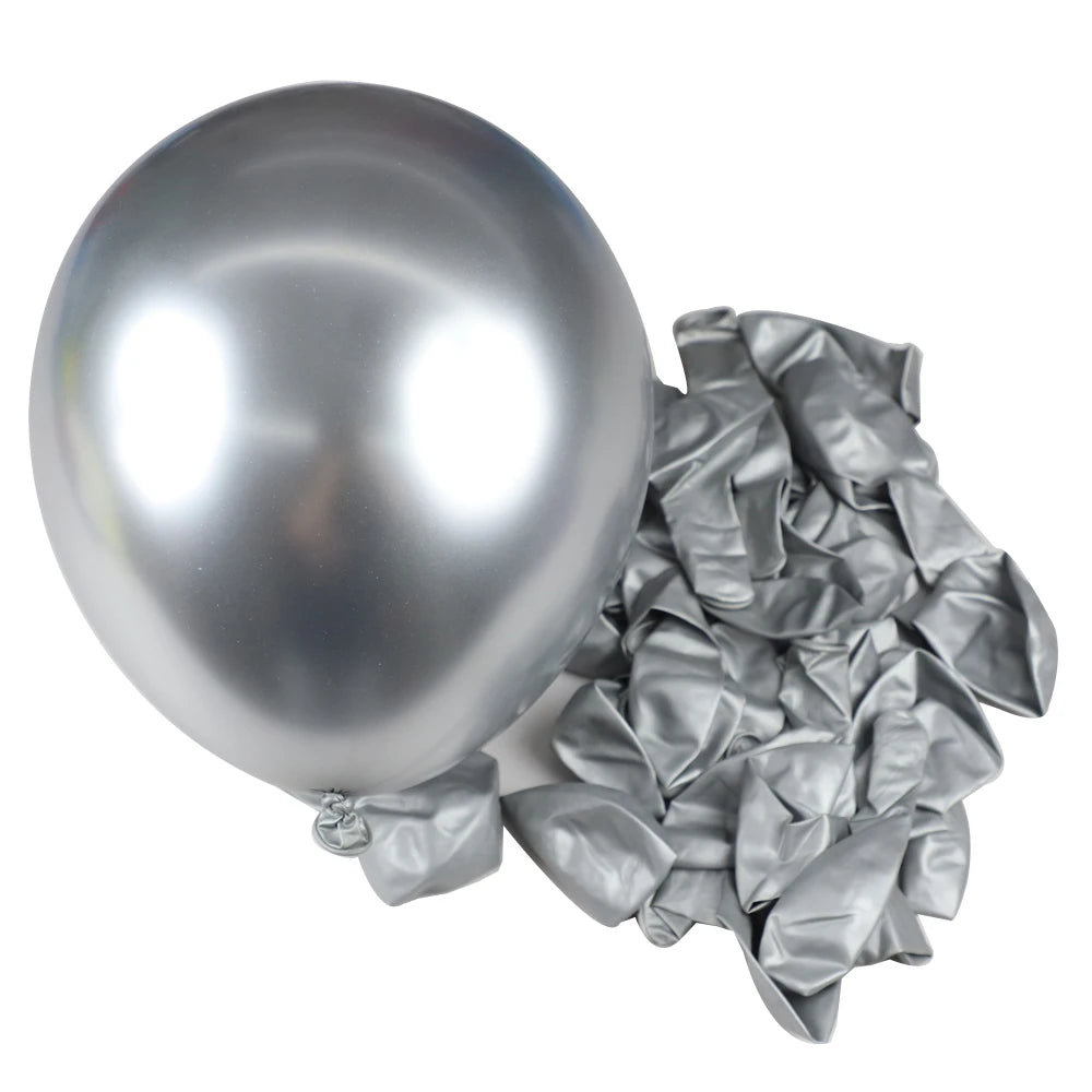 A single silver chrome metallic latex balloon next to a cluster of crumpled silver foil balloons for party decor.