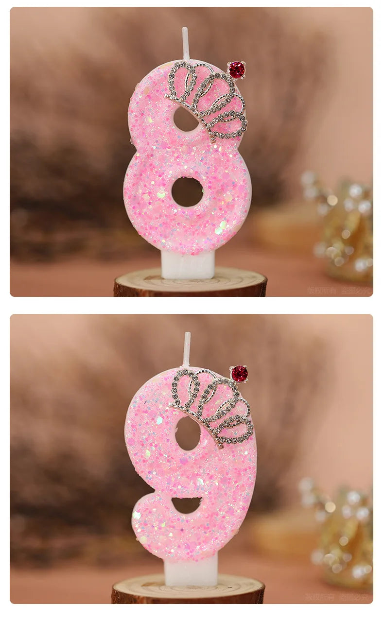 Two pink glitter birthday candles shaped like the numbers 8 and 9 with crown toppers