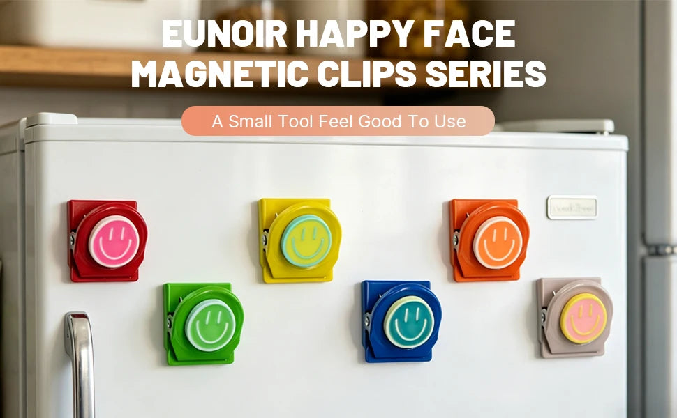 A series of colorful magnetic clips in various colors are displayed on a white refrigerator surface.