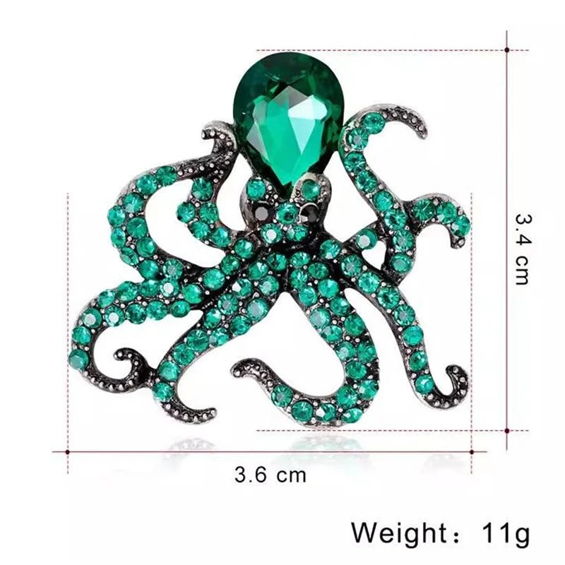 A vintage marine life brooch pin set featuring a green gemstone starfish design.