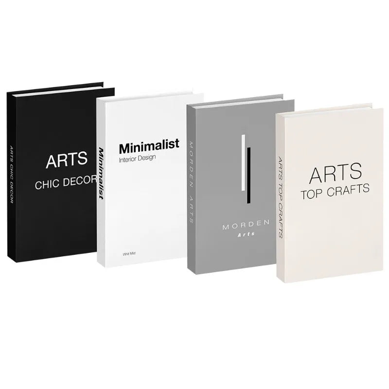 A set of three minimalist decorative faux books in black, white, and gray for home decor