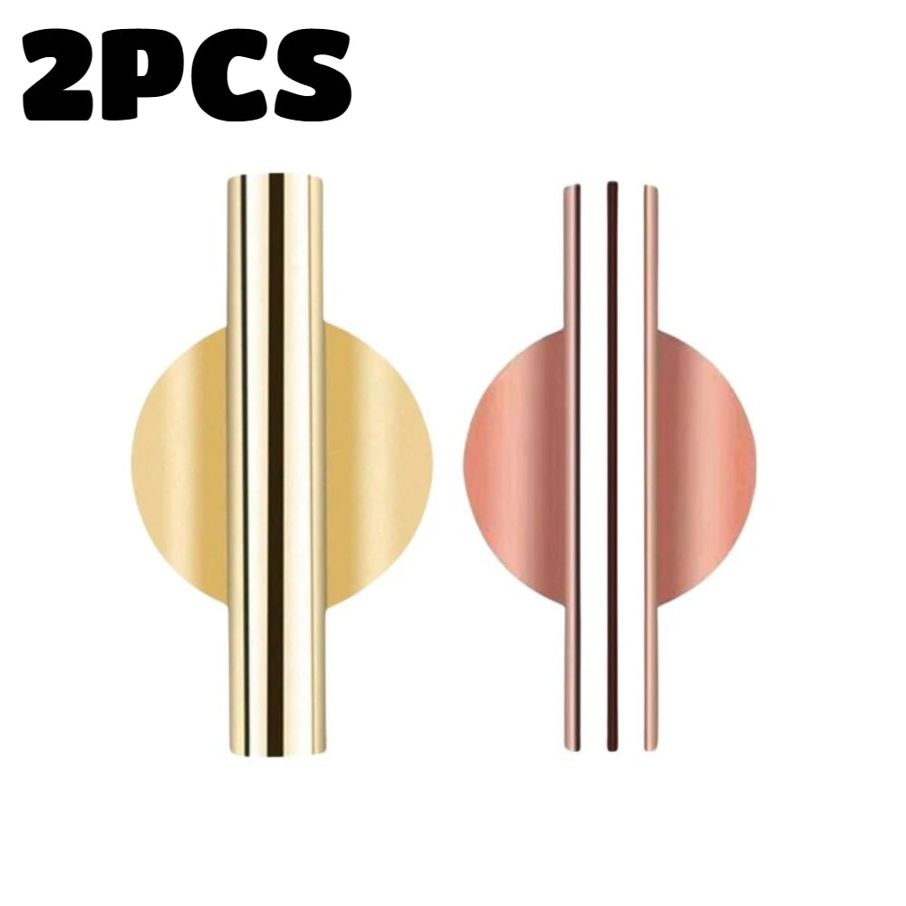 Two modern wall-mounted flower vases featuring vertical metallic stripes in gold and rose gold tones.