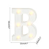 A white alphabet letter light shaped like the letter B with warm white LED illumination