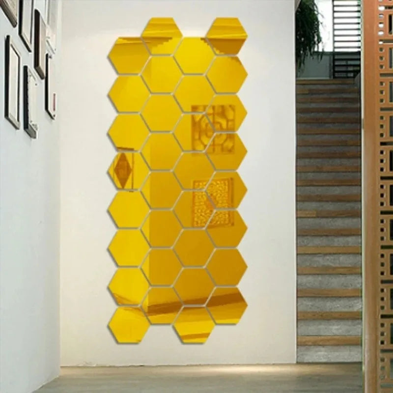 A vertical wall decor piece made of yellow, self-adhesive hexagon mirror stickers mounted on a white wall.