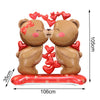 A pair of cute brown teddy bear figurines made of foil-finish material with red heart letter balloons.