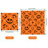 Orange paper napkins featuring a repeating pattern of Halloween skulls, spiders, and bats.