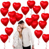 A couple is holding a red heart-shaped latex balloon, surrounded by many red heart balloons.