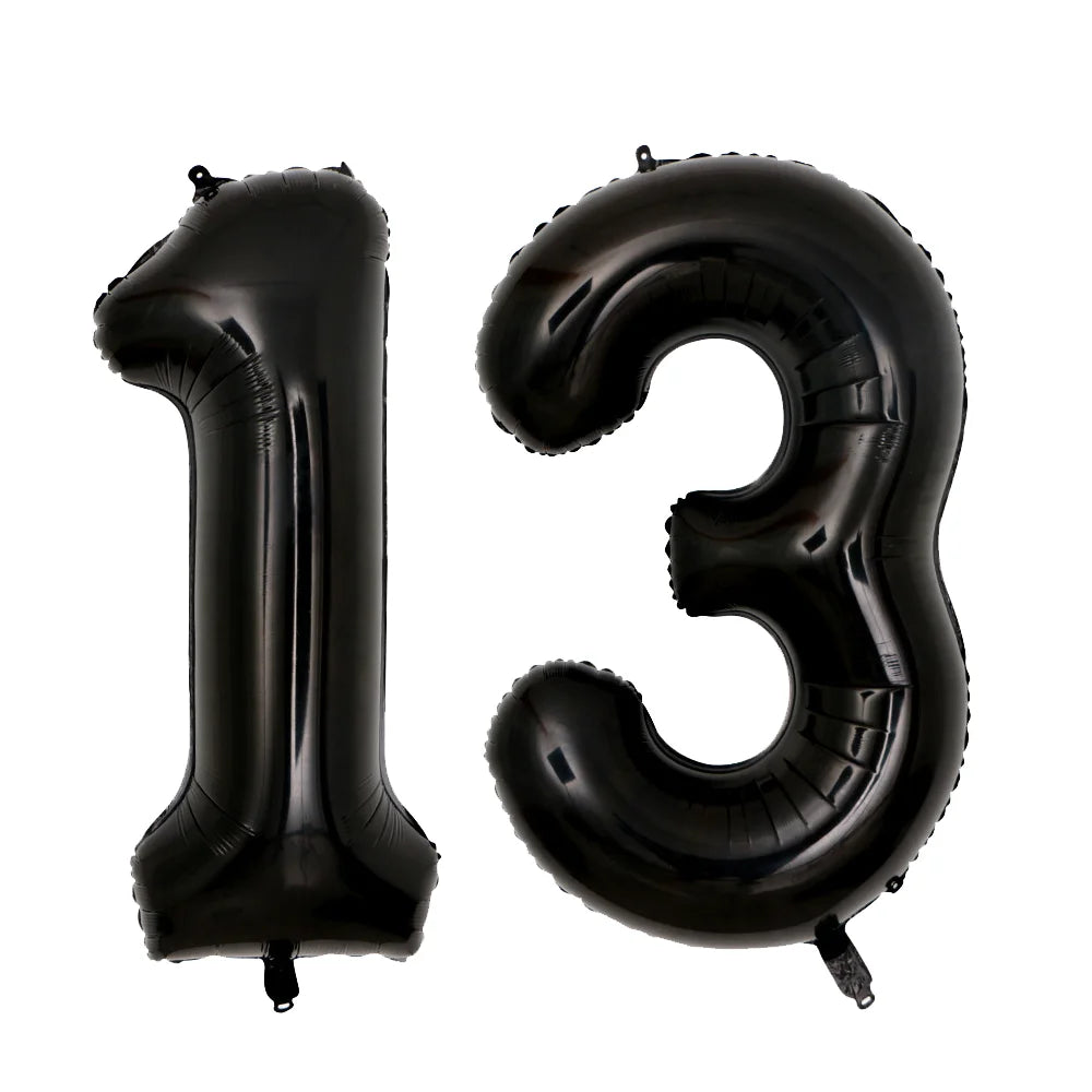 Two black foil balloons shaped like the number 13