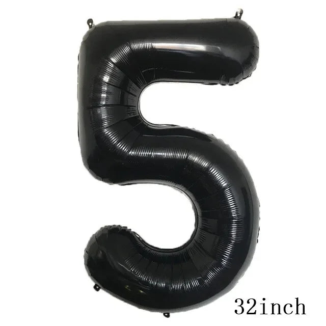Black foil balloon shaped like the number five