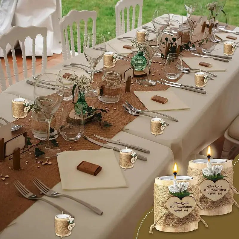 A table setting featuring wooden tealight candle holders with thank you messages and elegant silverware.