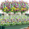 A dense display of colorful faux floral plants featuring white, pink, purple, and yellow blooms for outdoor decoration.