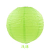 A round, translucent lime green paper lantern.