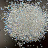 A pile of multicolor AB glass micro beads scattered across a dark surface.