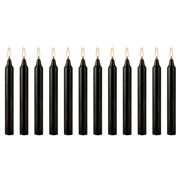 A set of twelve black taper candles standing upright in a row.