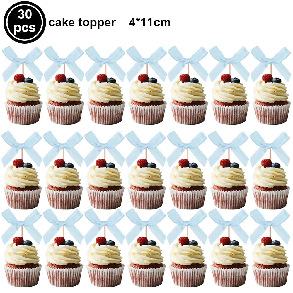 A set of 30 pink bow cupcake toppers measuring 4x11cm.