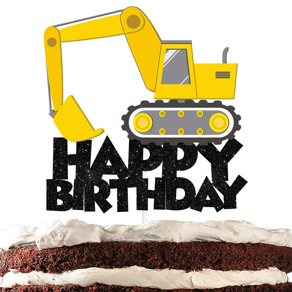 A yellow construction excavator foil balloon decoration placed on top of a birthday cake.