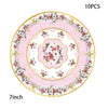 A decorative vintage floral paper tableware set featuring pink and white flowers on a gold rim.