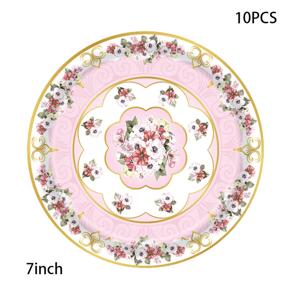 A decorative vintage floral paper tableware set featuring pink and white flowers on a gold rim.
