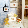 A display of handcrafted miniature mushroom tableware and decorative items for dollhouses.