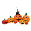 An orange Halloween pumpkin inflatable decoration with a black devil face and built-in LED lights.