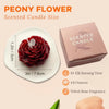 A box of a scented candle and a close-up of a deep red rose-shaped candle.