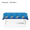A blue tablecloth featuring a pattern of sharks and ocean waves for a party decoration.