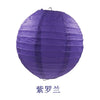 A purple round paper lantern used for parties and weddings.