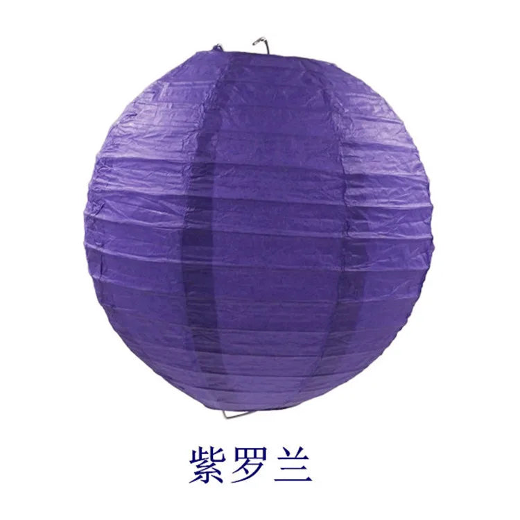A purple round paper lantern used for parties and weddings.