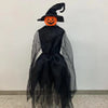 A black witch hat with pointed ears and an orange carved pumpkin face decoration.