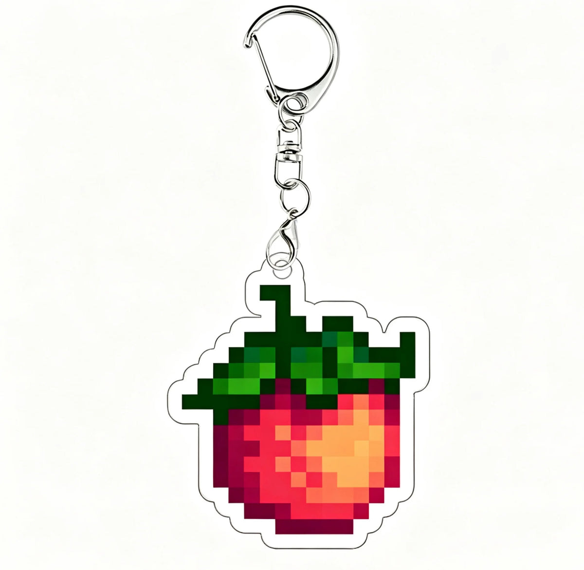 A shiny silver acrylic keychain charm shaped like a red strawberry with green leaves.