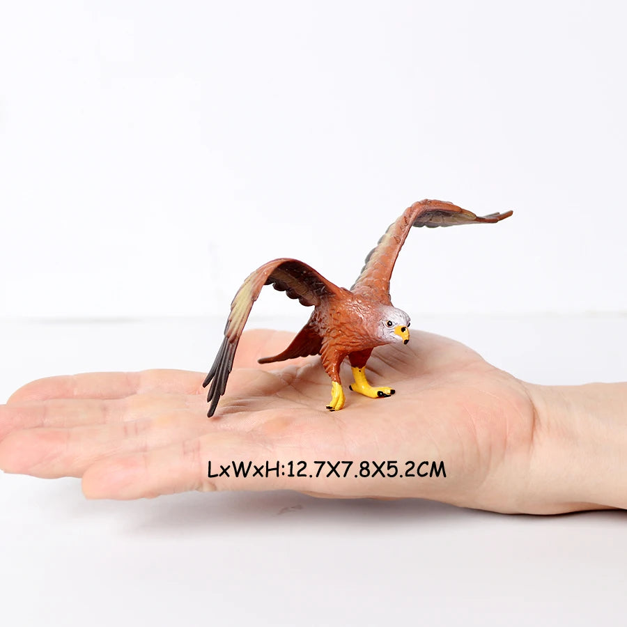 A realistic figurine set of an owl, vulture, and bald eagle perched on a human hand.